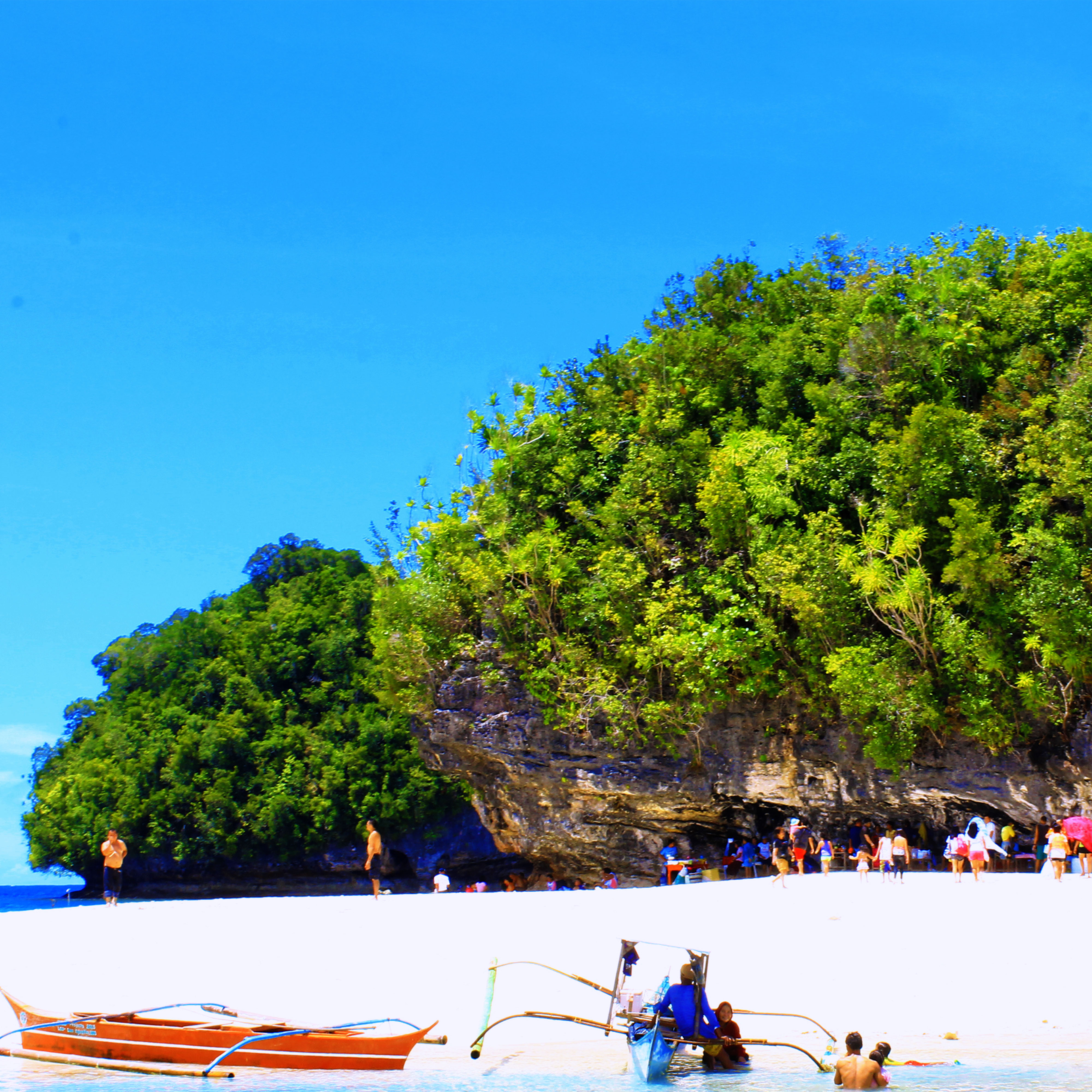 <b class="font-bara"><i class="bi bi-geo-fill h4"></i> BUSLON ISLET</b> <br/>It’s fine, white sand and unique landscape is an ideal place for sunbathing and swimming. The islet is registered in the US Navy Coast and geodetic survey as Haycock Island along with three satellite islets. It was taken from the surname of a visiting Judge Teofilo Buslon who came to the former Lianga Bay Logging Company and was invited to grace a wedding and have a salo-salo in the islet.